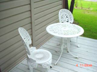 beautiful antique outside deck table and chairs at courthouse inn bed and breakfast